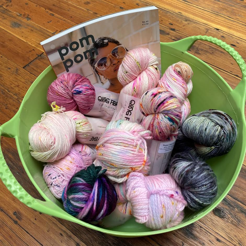 bucket of skeins of Qing and Pom Pom Quarterly