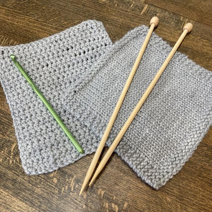 crochet swatch and hook, knitting needles and swatch